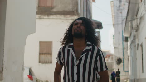 young man walks in the streets of old town