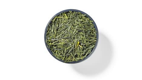 sencha green tea in round bowl on white background, seamless loop