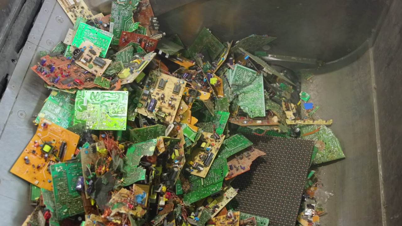 Colorful Circuit Boards In Metal Drum, Assorted Pcbs With Resistors And Capacitors Visible, Stainless Steel . Media