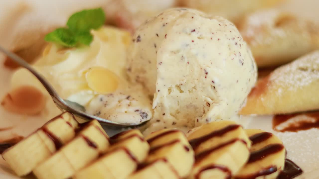 Fork scooping ice cream with banana slices