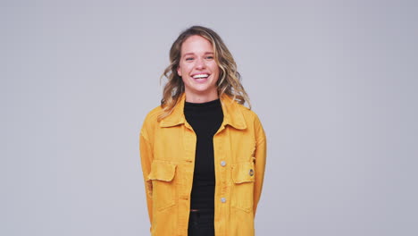 Wide-Angle-Studio-Shot-Of-Woman-Laughing-At-Camera-In-Slow-Motion