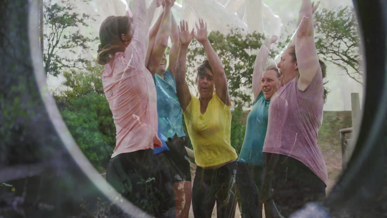 Raising arms joyfully, women in colorful shirts celebrating outdoors animation