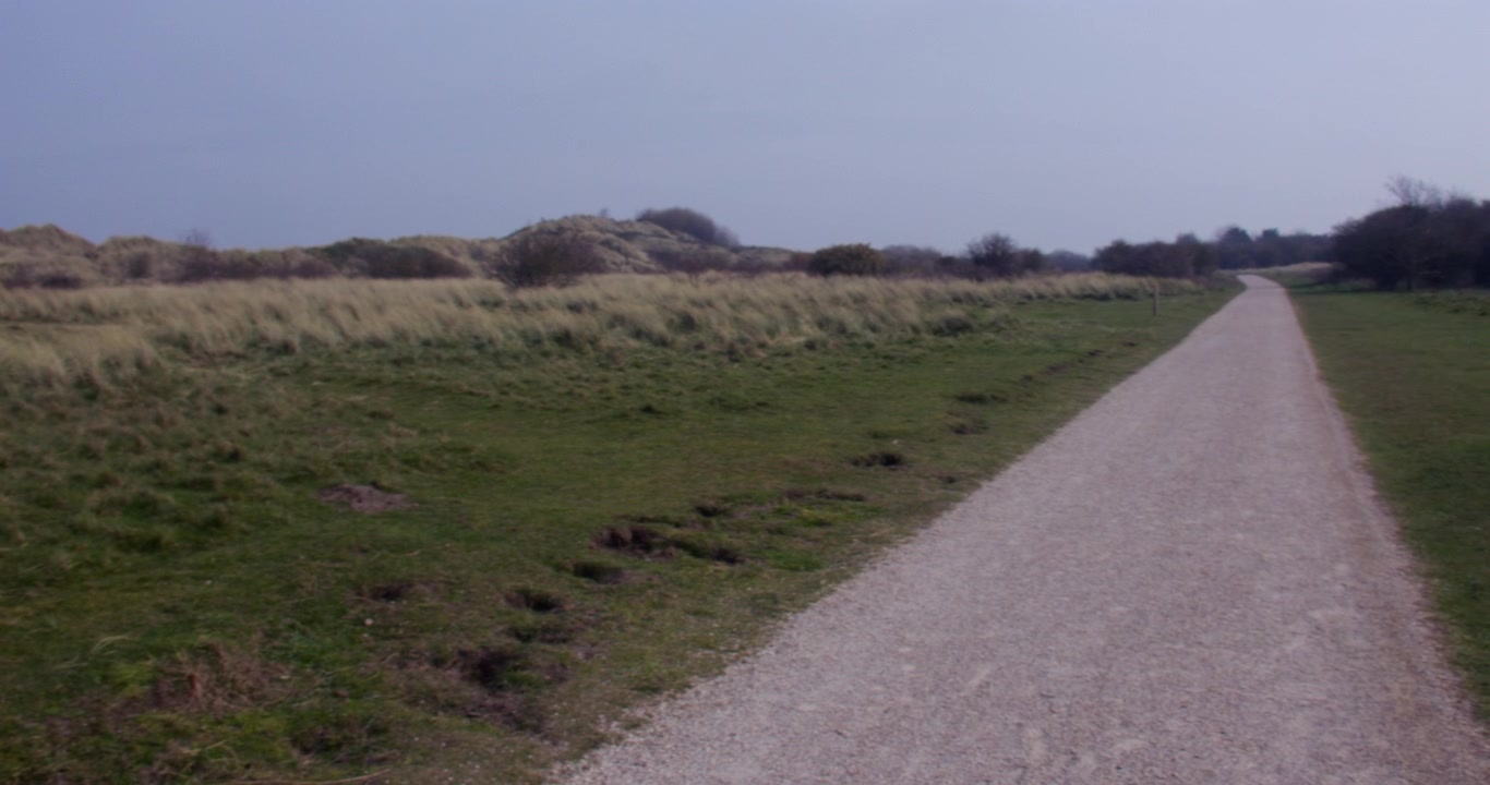 Wide panning shot looking west on the Dee coastal path at Talacre Warren,