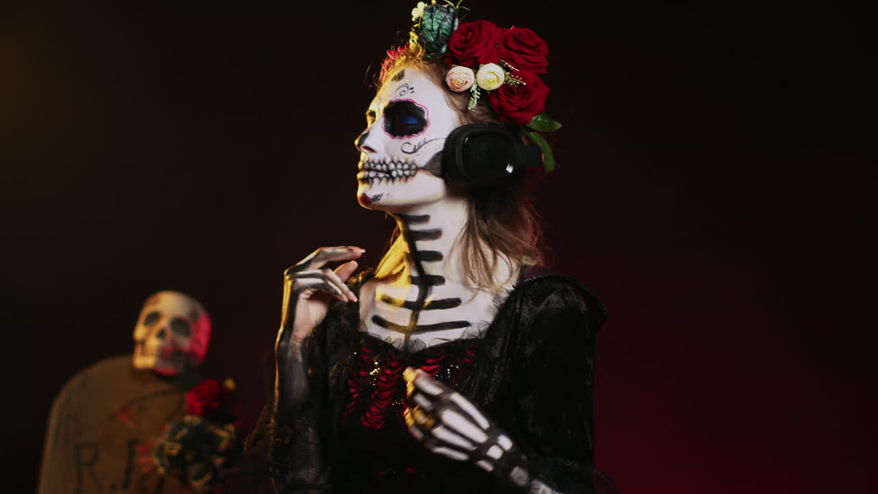 Woman in Day of the Dead makeup with headphones