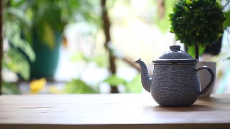 two adults take a glass of tea on the table in the morning and drink it together