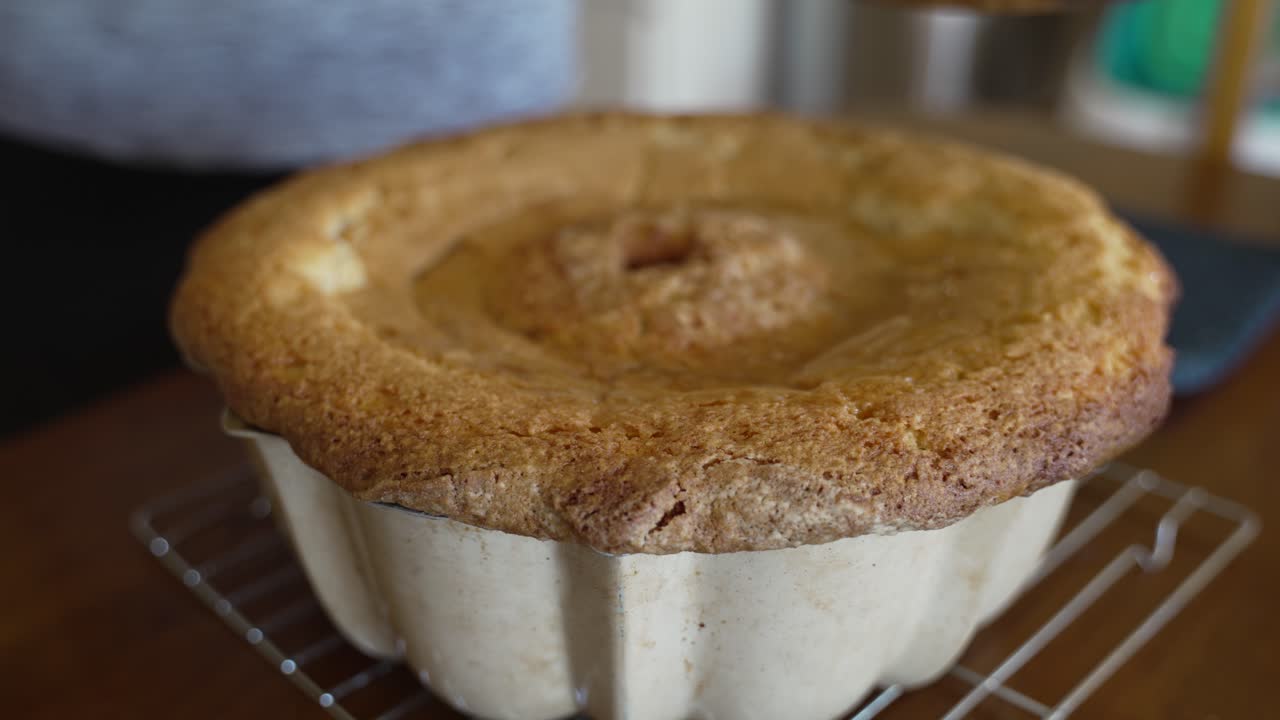 Spooning glaze over the bottom of a Kentucky butter cake - POUND CAKE SERIES