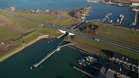 Aerial-View-Of-Cars-Driving-Through-Goereesesluis-Near-The-Harbour-In-Haringvliet-Inlet-in-the-Netherlands