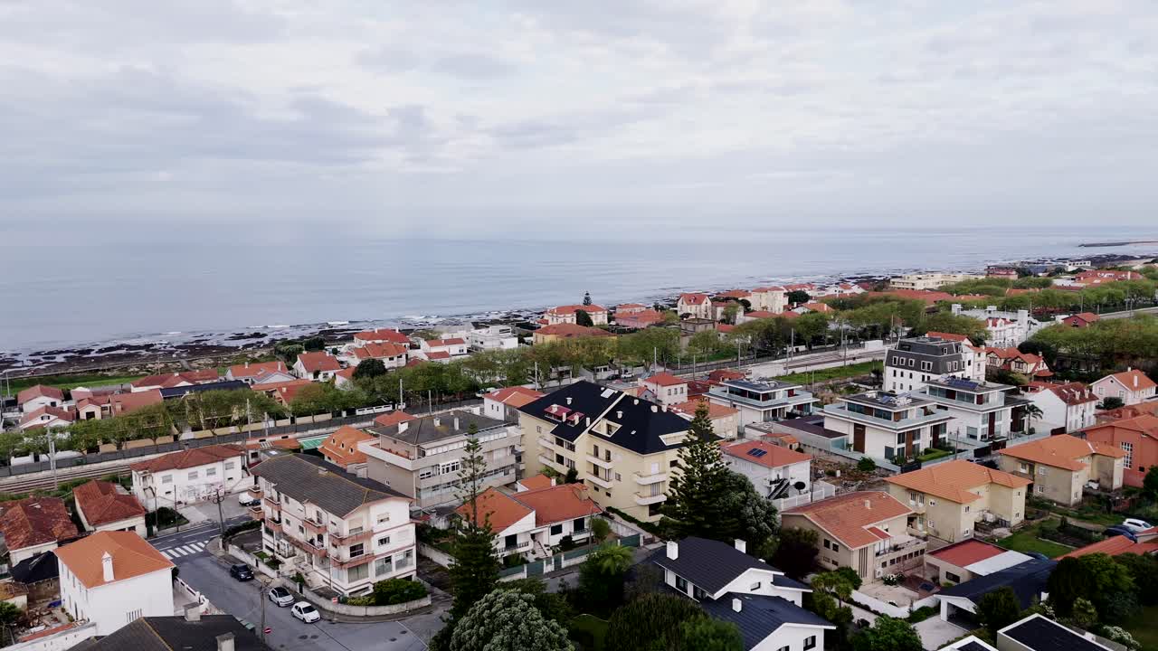 residential houses stretch along the coastline of gaia portugal near the atlantic ocean