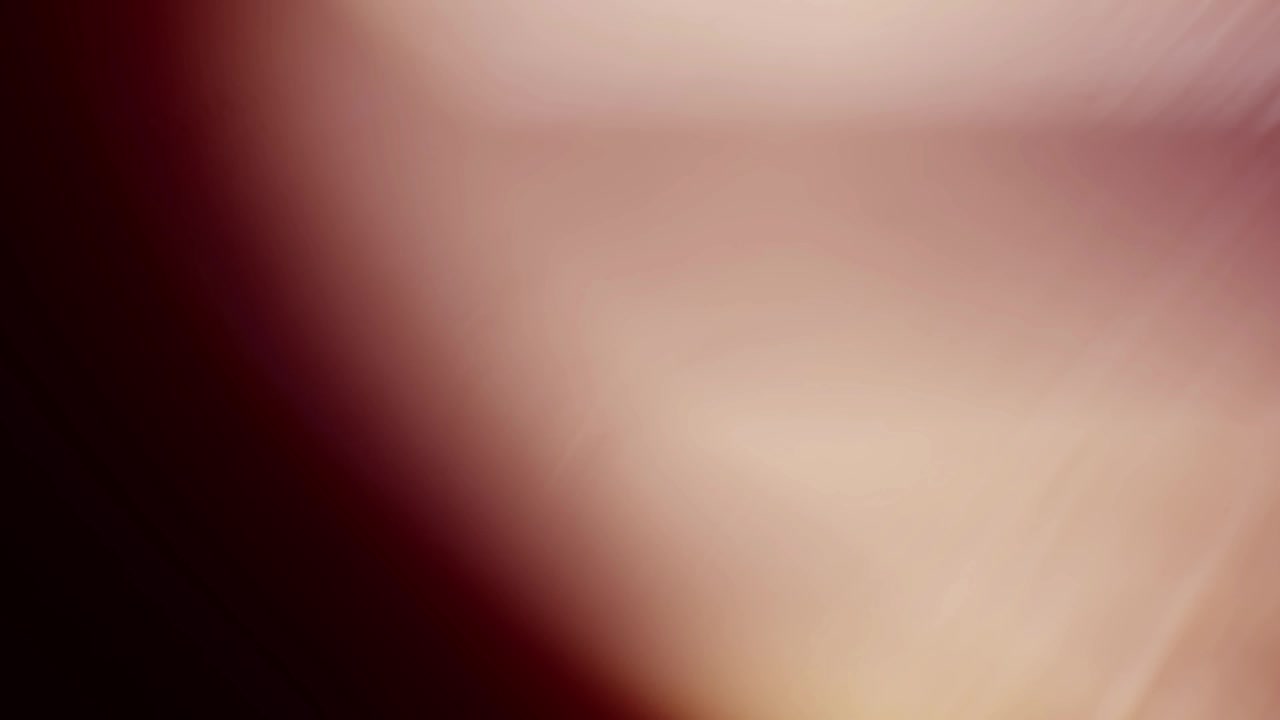 Soft Warm Light Leak Transitioning on Dark Background