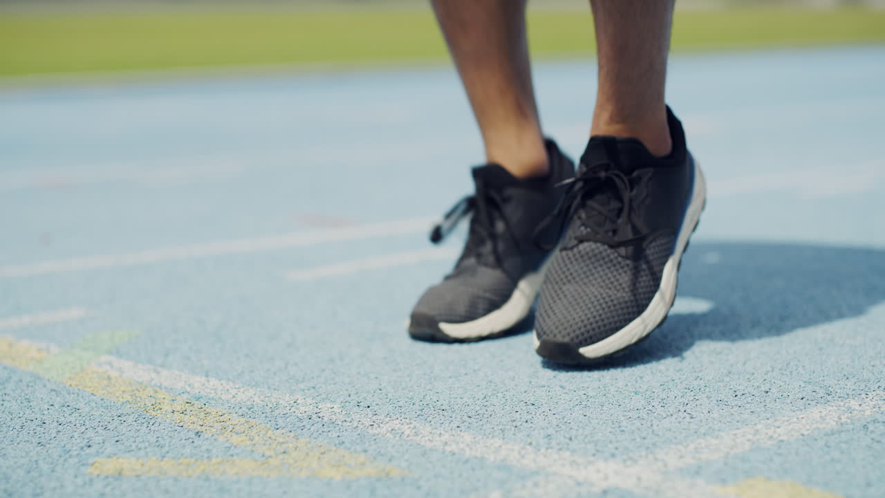 Closeup of athlete tying shoe laces