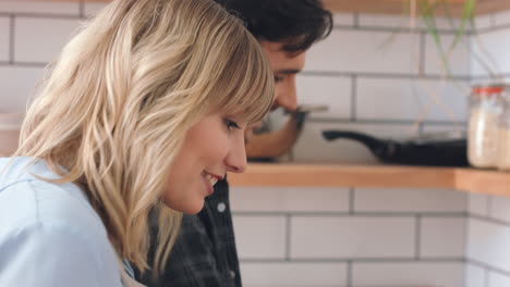 Couple-in-kitchen-cooking-food-together