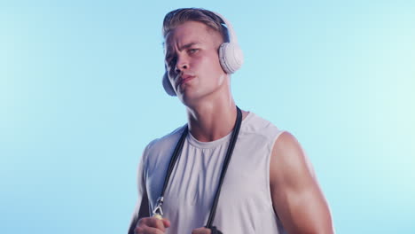 man jumping rope with headphones