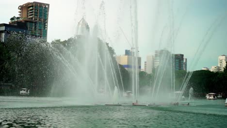 fountain in the middle of the lake in the lumpini park, bangkok, slowmotion 120fps