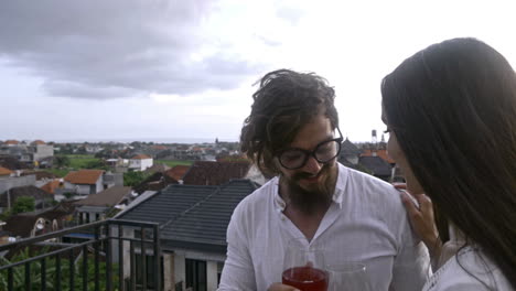 romantic couple in casual clothes on a terrace