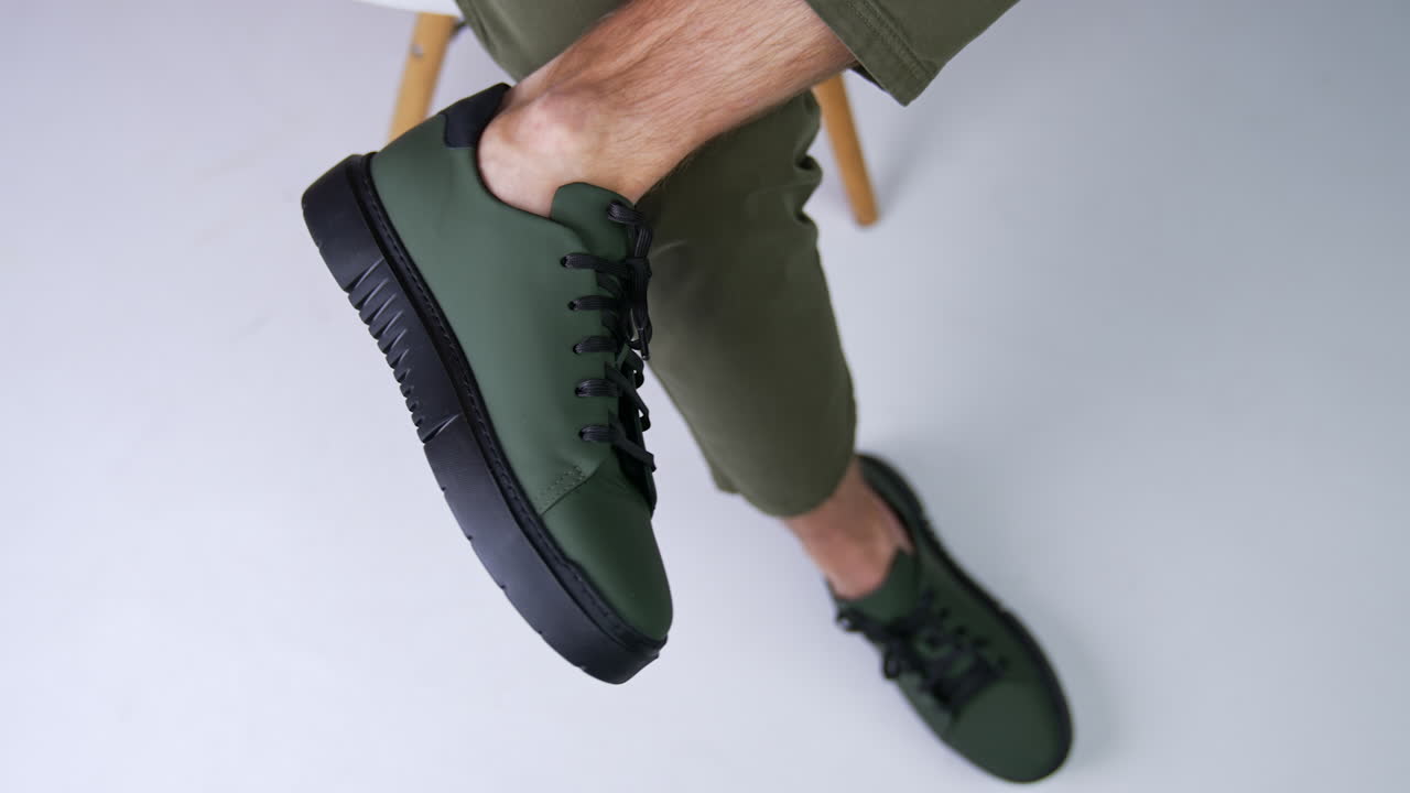 Dark Green Leather Sneakers on Man's Feet