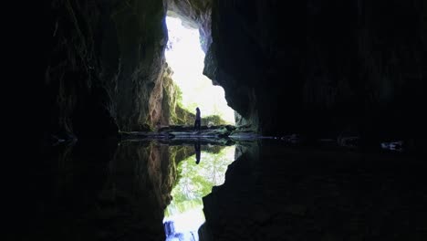 traveller woman entering the cave