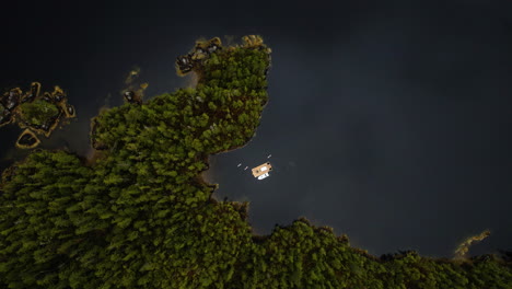 aerial top-down ascent over floating sauna in bay of clayoquot sound, tofino, bc