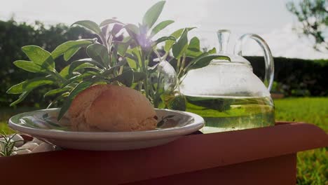 afternoon tea with fresh scone made with of sage leaves, and on the side sage tea