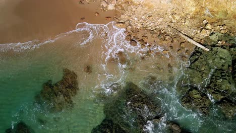 Waves-lapping-up-to-the-shoreline-of-rocky-beach