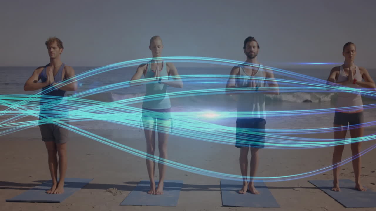 People practicing yoga on beach with blue light trails animation over them