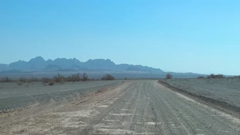 driving in desert mountain background empty road in summer season iran saudi arabian nature landscape drive family trip summer day scenic flora beautiful sand dune horizon sunlight in outdoor leisure