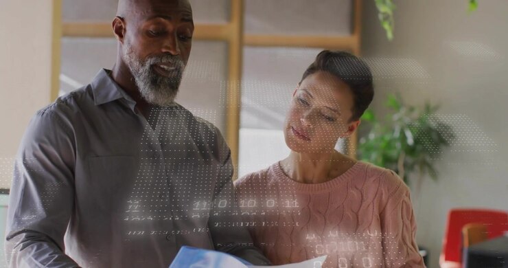 Woman pointing green file initiating man flipping blue file as business graph overlaying insights