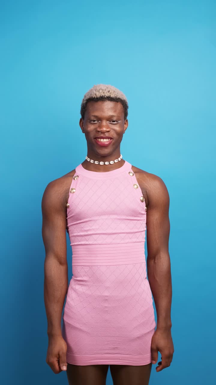 Glad black non binary person gesturing thumb up