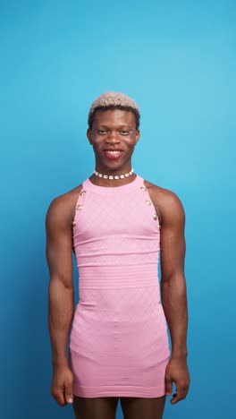 glad black non binary person gesturing thumb up