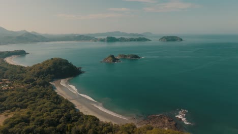 turquoise ocean and scenic shore of a beach in guanacaste, costa rica - aerial drone shot