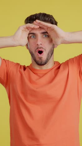 man looking up with a curious or searching expression