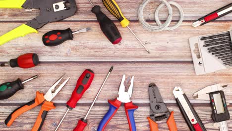 construction and do it yourself tools move on wooden table - stop motion