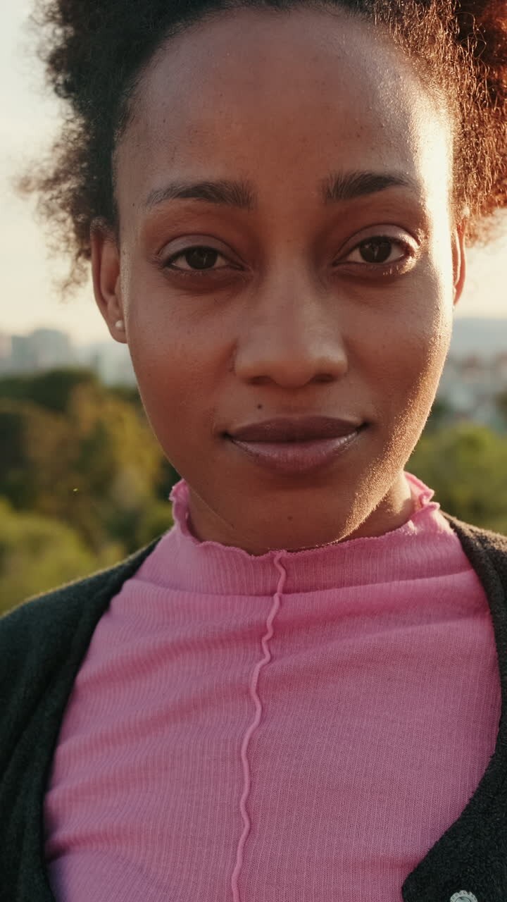 Young Woman Smiles in Golden Hour Park