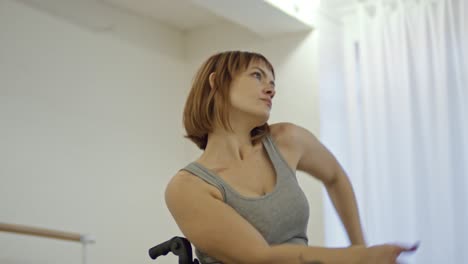 expressive woman in wheelchair learning dance