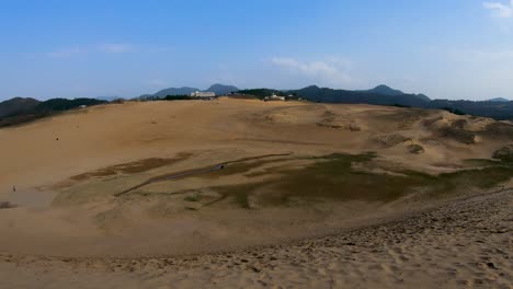 panning shot of tottori sand dunes, kaigan geo park and sea of japan