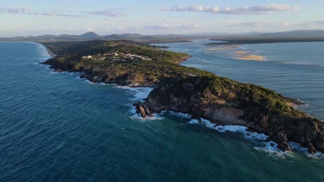 panorama of a seventeen-seventy town on a peninsula amidst the coral sea in qld, australia