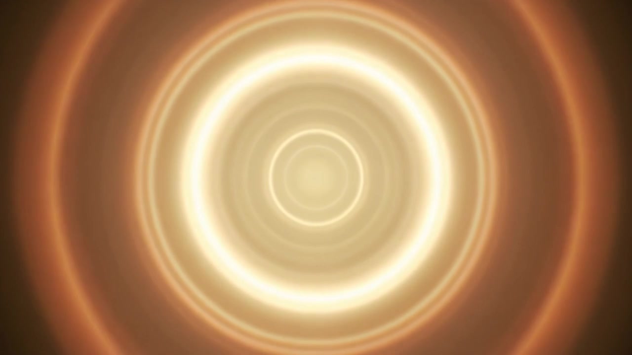 Abstract Golden Light Rings Pulsing in a Dark Background