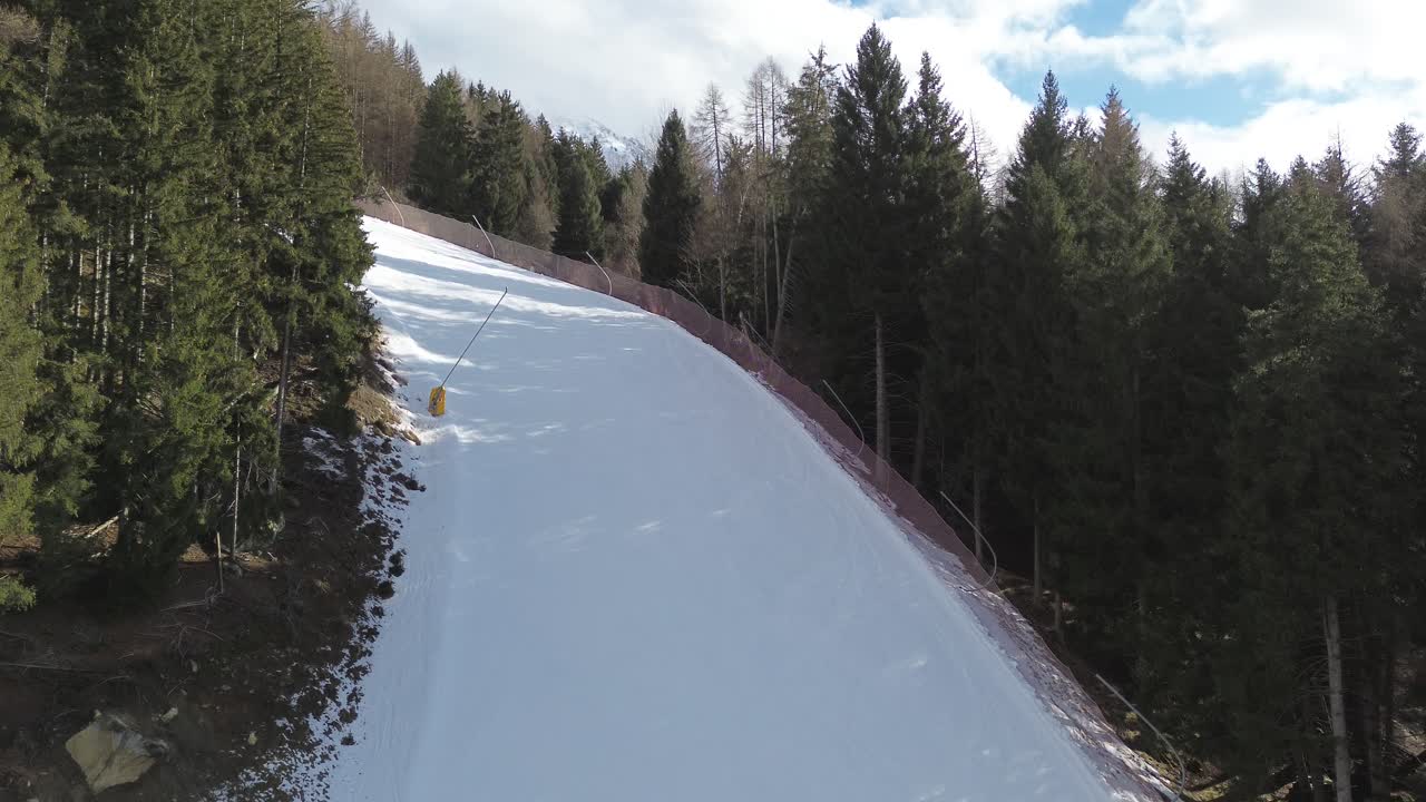 There are winter sports that play the role of the Winter Olympics in Cortina and Milano Italy. Learning to ski and snowboard I capture these videos with my drone that is in a ski resort. roads white