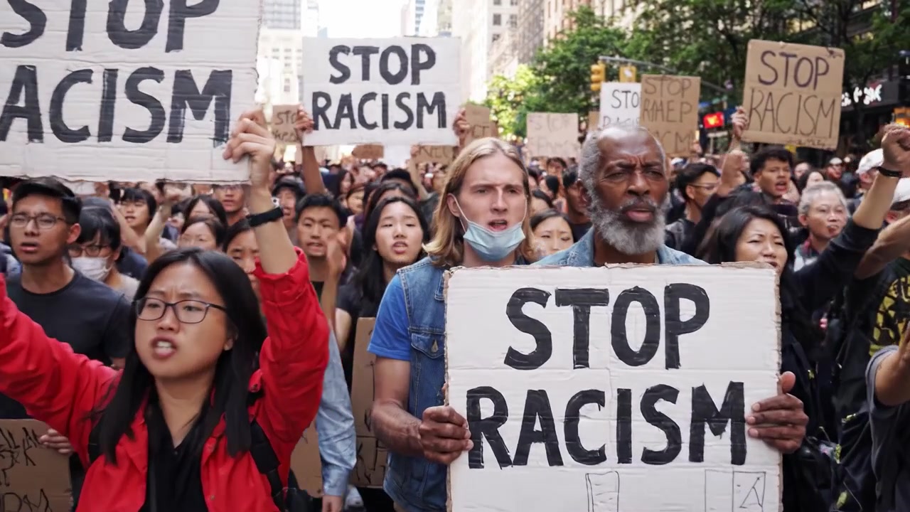 A Powerful Gathering of Activists United Against Discrimination: Stop Racism Movement Captured in a Vibrant City Landscape