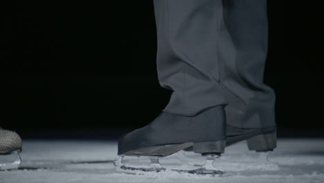 couple on the ice starting their love dancing