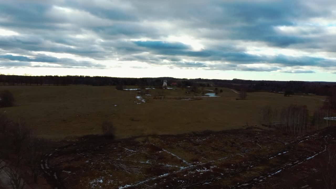 Old Araisi Windmill in Latvia Aerial Shot From Above. Winter Day at Sunrise. This Is the Only Windmill in Latvia at Working Order Built in 1852. 4K Shot