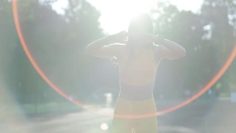 woman jogging on outdoor track in sportswear at athletic field