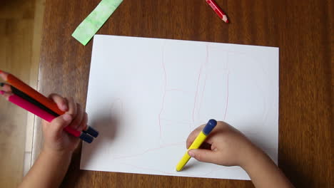 child is drawing doodle with crayons, toddler learn and play