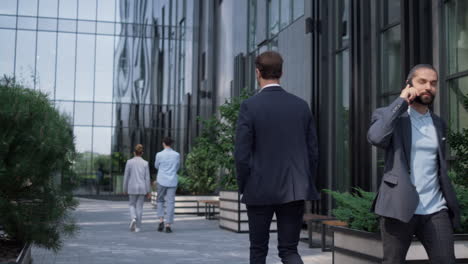 diverse corporate workers going to workplaces in morning. modern downtown area