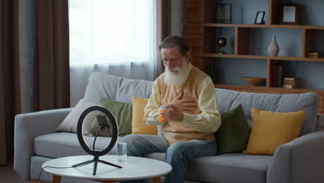 elderly man taking medication via video call