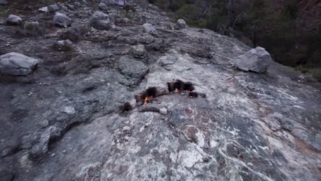 eternal flames: natural gas burning out of stone rocks at mount chimaera, turkey