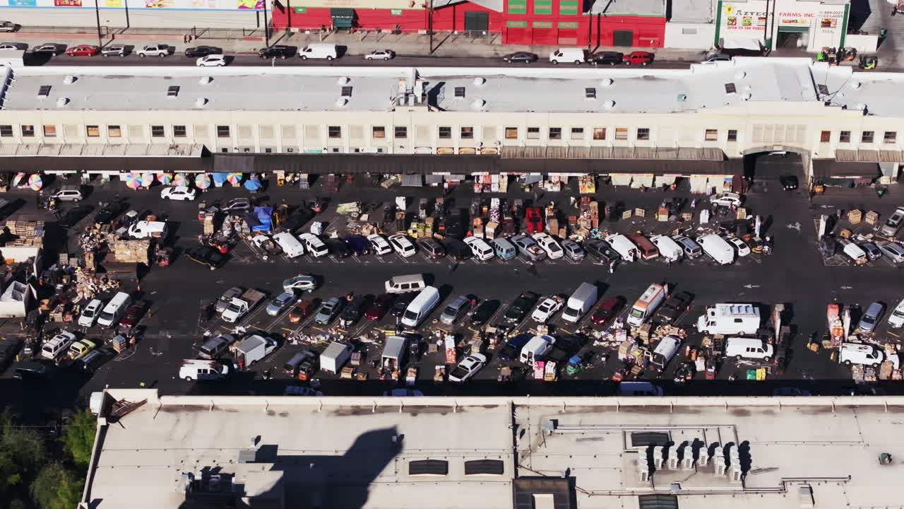 Aerial View of a Bustling Outdoor Wholesale Market and Parking Lot