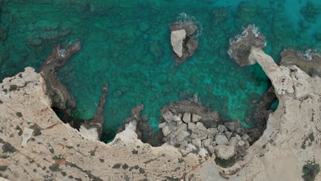 Love-bridge---Aerial-stunning-natural-rock-formations-of-Ayia-Napa-from-a-top-down-perspective