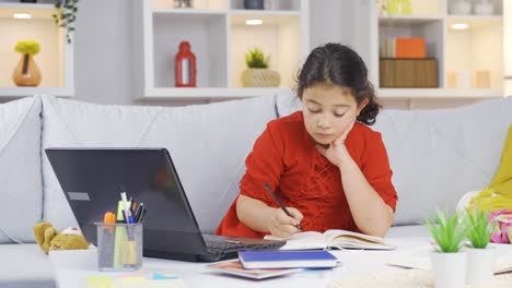 girl child studying on laptop.