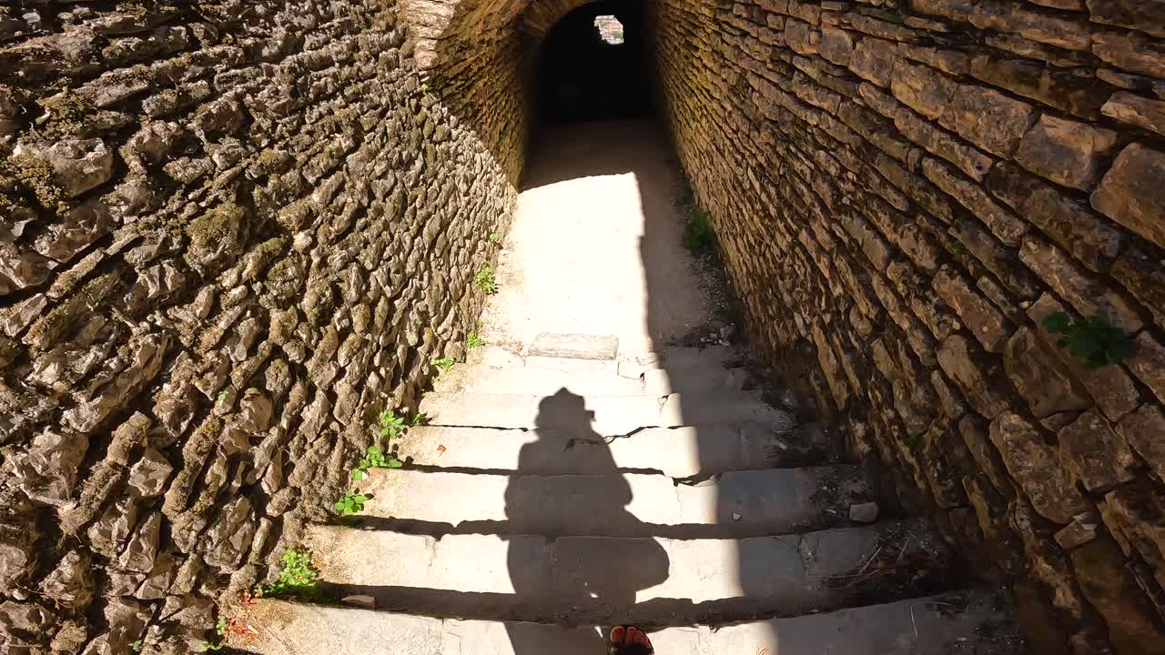 Stone stairs leading into a tunnel