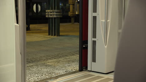 low angle of opening door in train and construction worker in protection clothes boarding